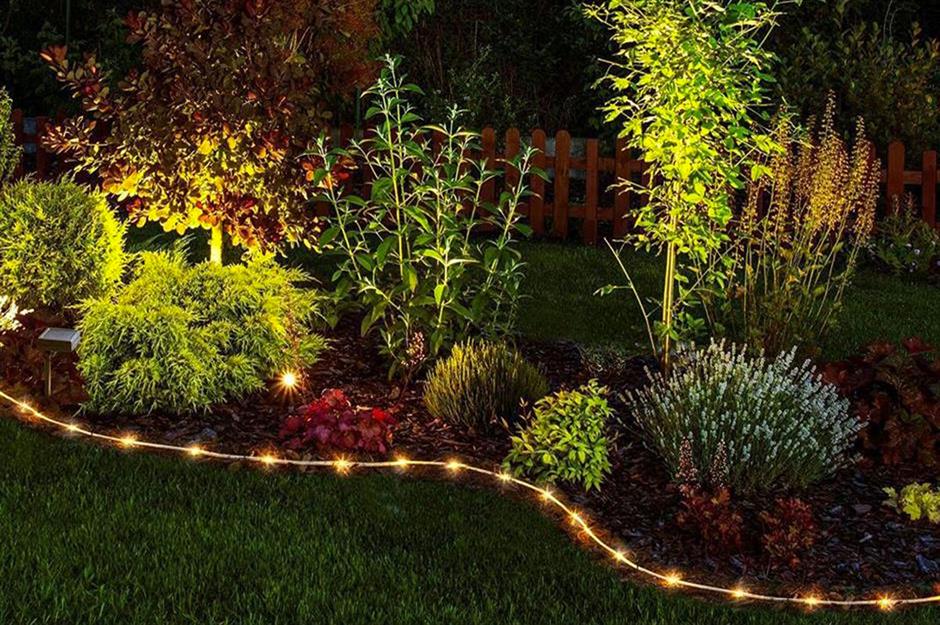 rope lights in flower bed