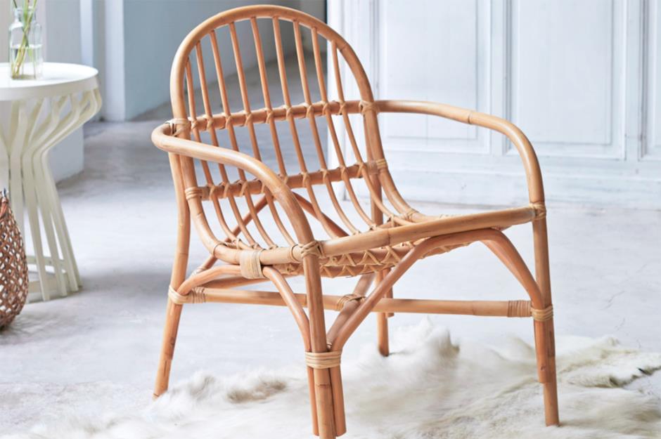 A bamboo chair in a white room 