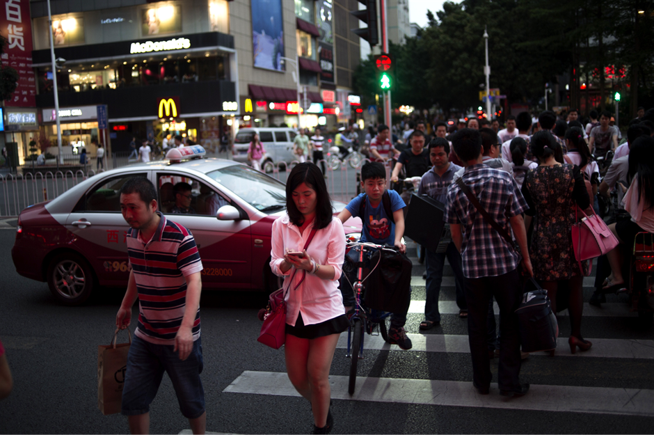 China: using your phone while crossing a road – up to $8 (£6) fine