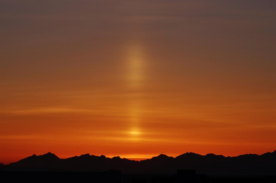 Sun pillars, Mount Olympus, Washington, USA