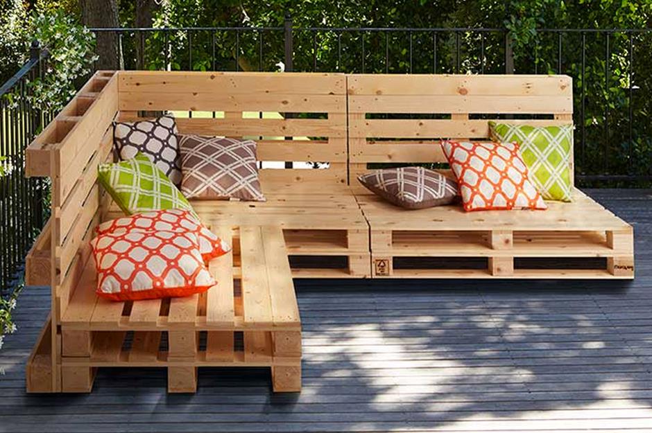 Natural wood pallet outdoor sofa and through pillows