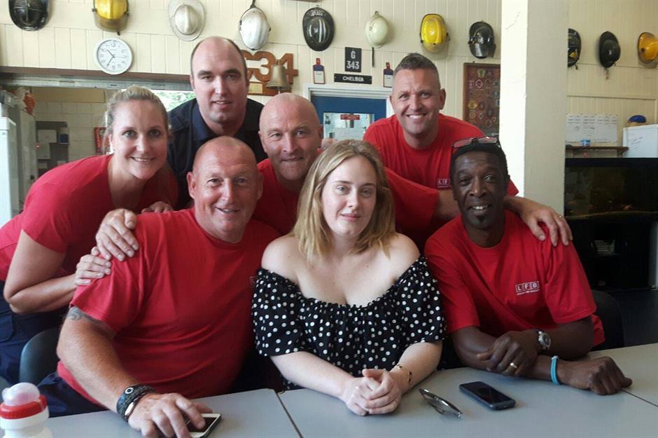 Adele sings with fans and surprises firefighters