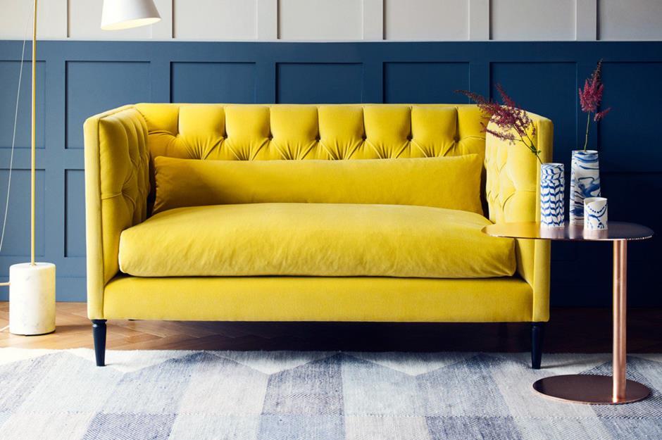 Blue room with burnt yellow velvet sofa 