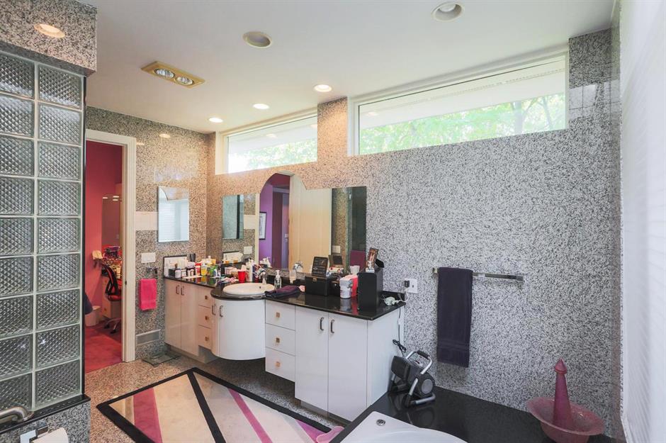 Gray 90s bathroom with glass bricks