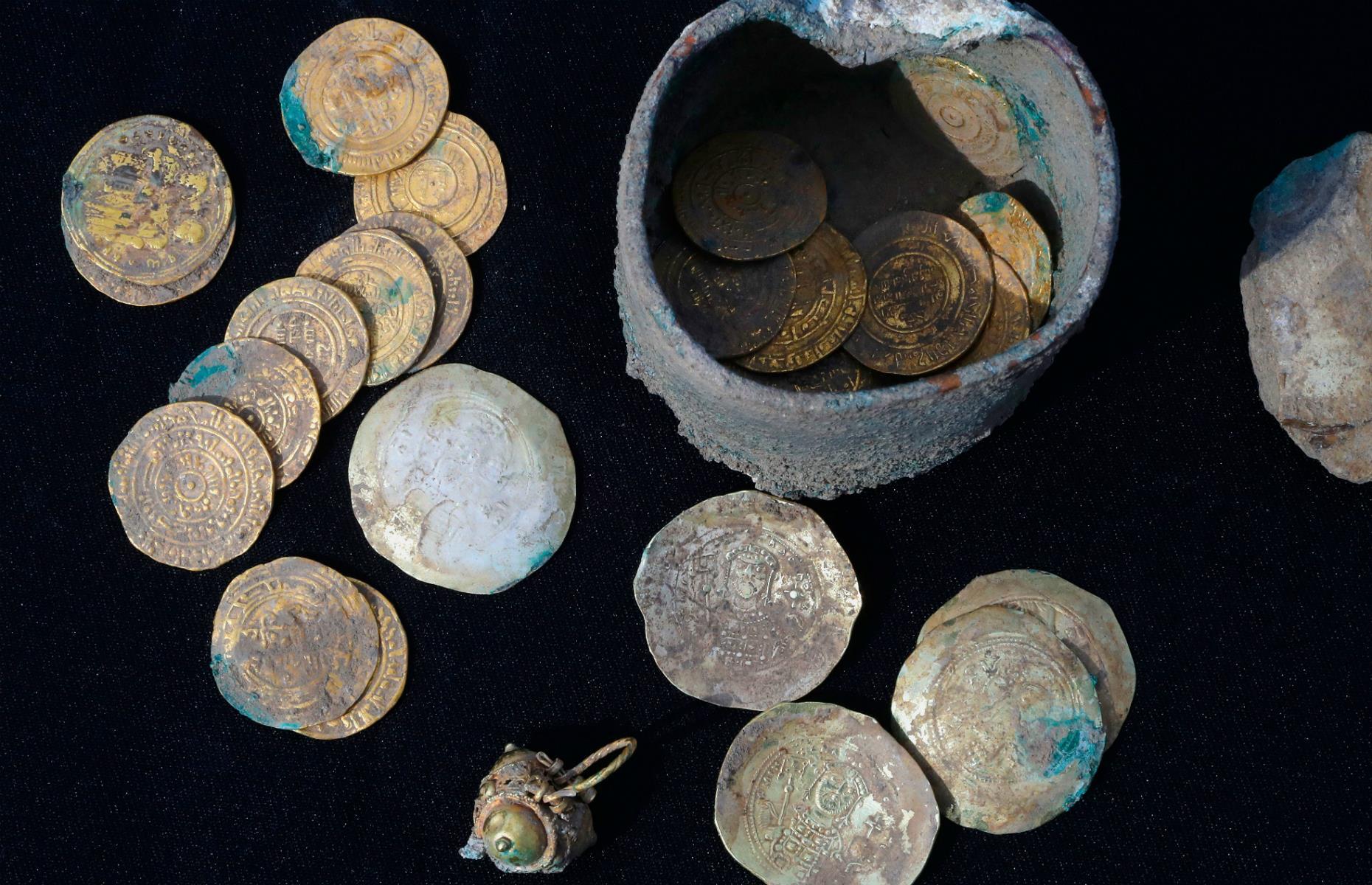 Dozens of pure gold coins discovered in secret cache dating from Muslim  conquest