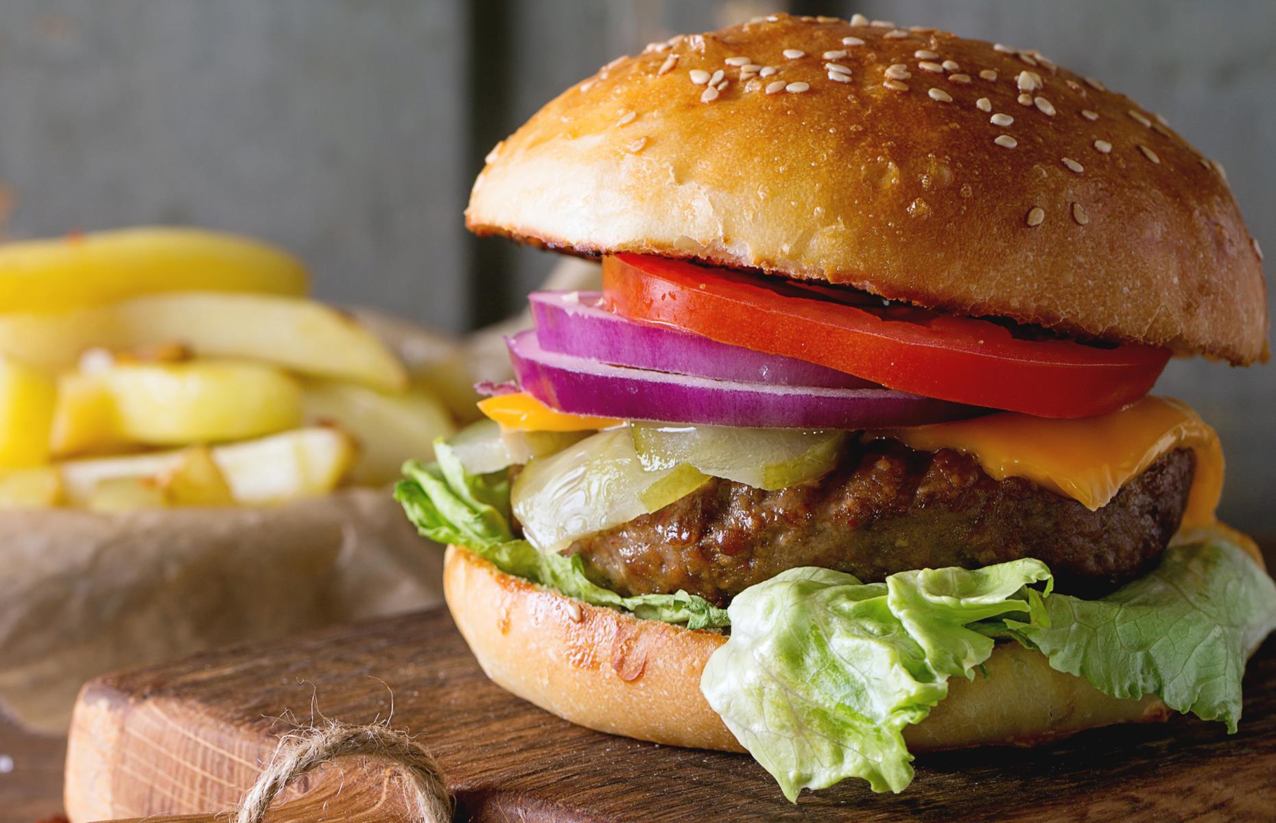 Use a burger lid to melt cheese