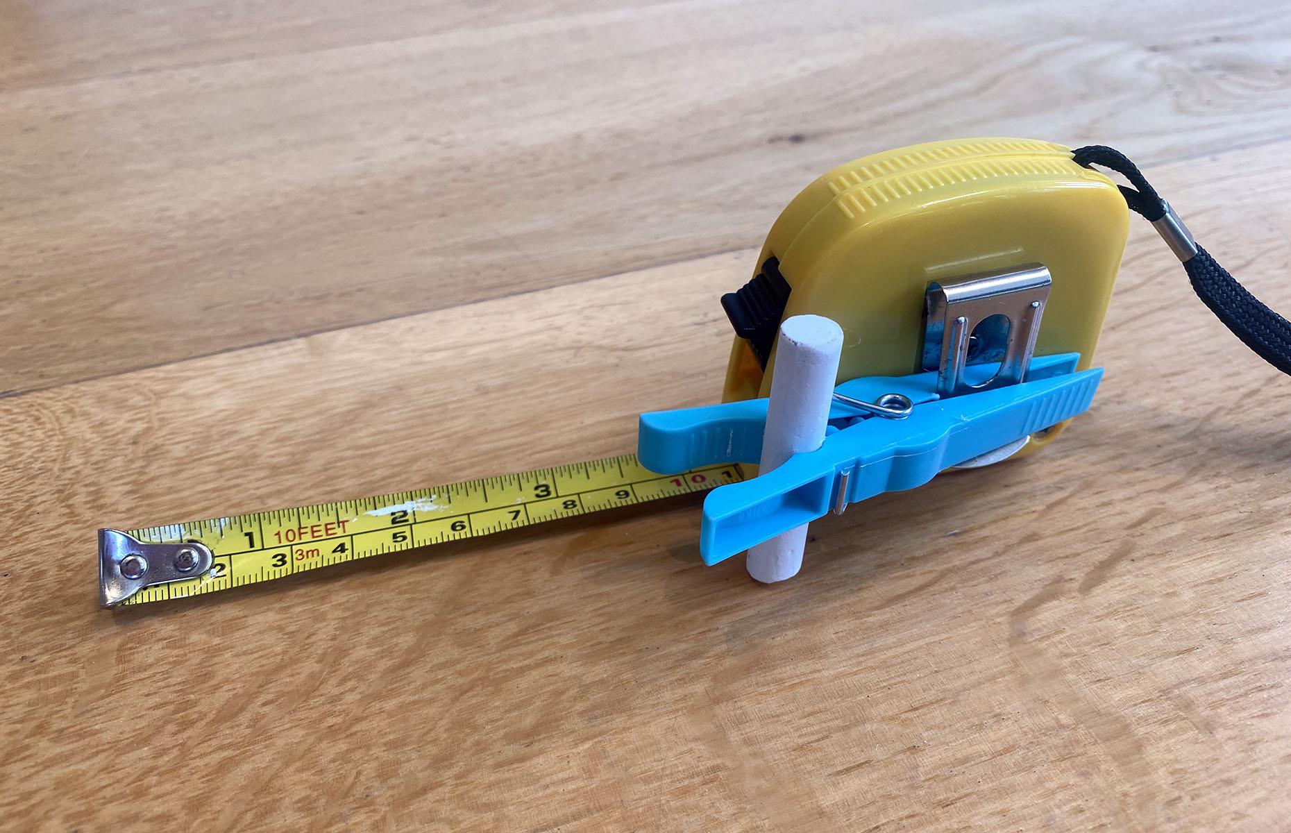 Clip a pencil onto a tape measure