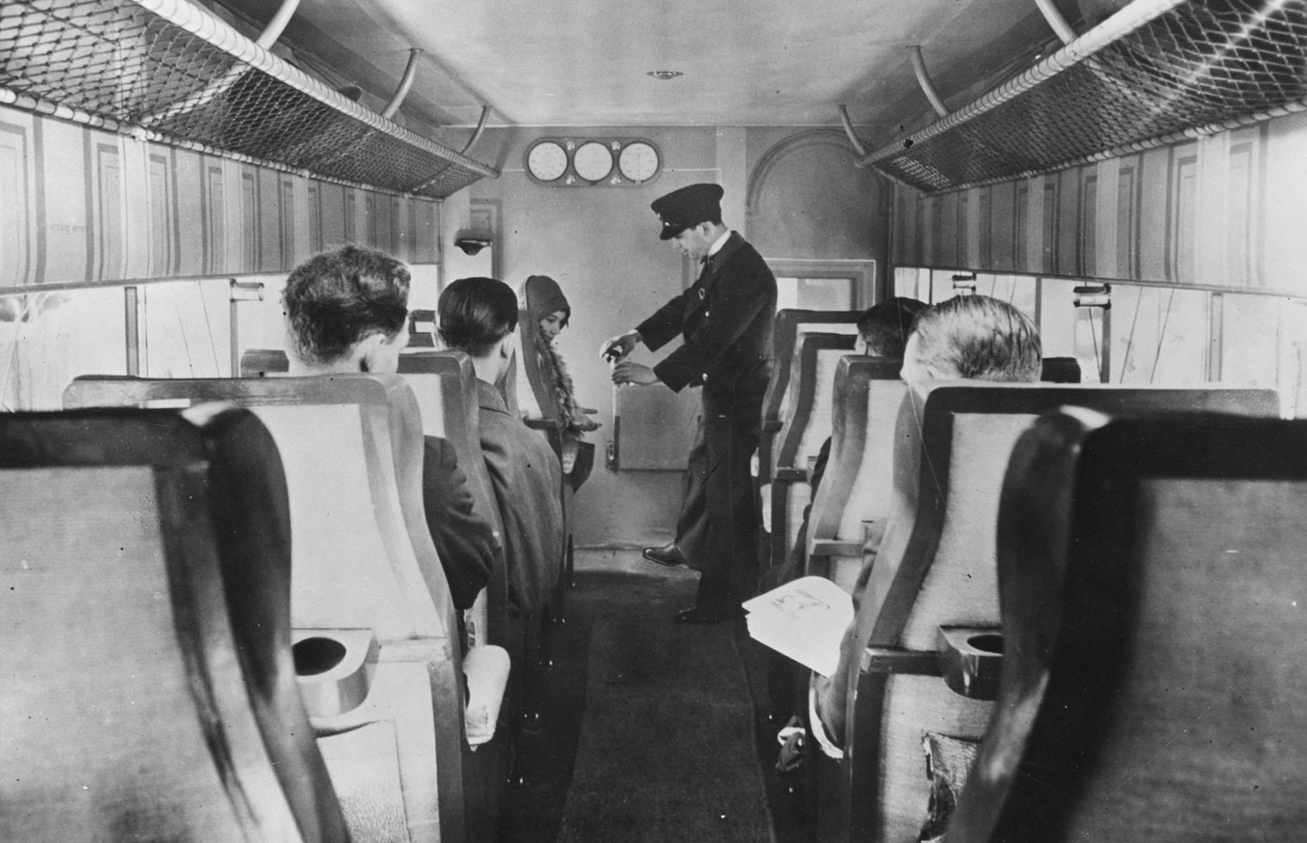 1920s: a flight attendant serves drinks on a French Airliner service