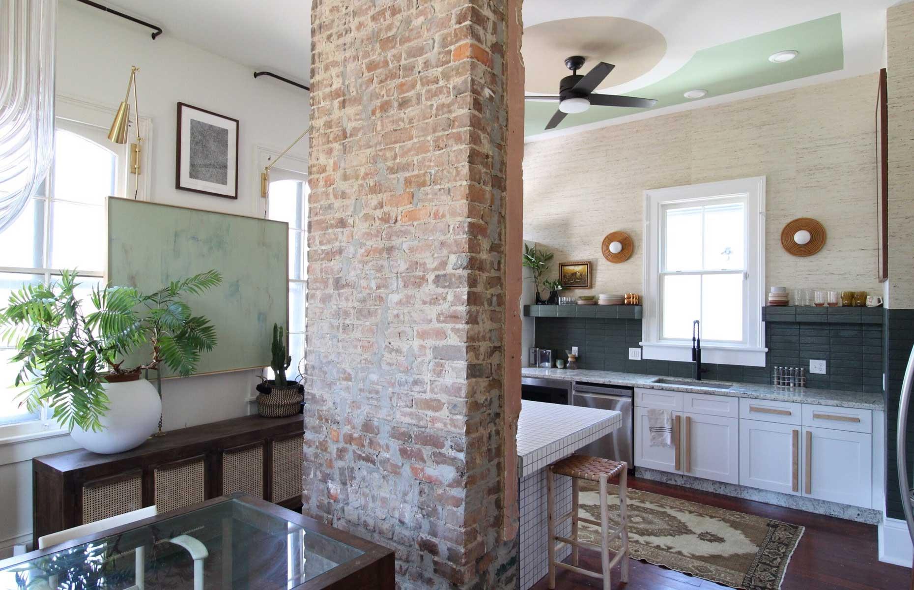 Eclectic kitchen with grass cloth walls