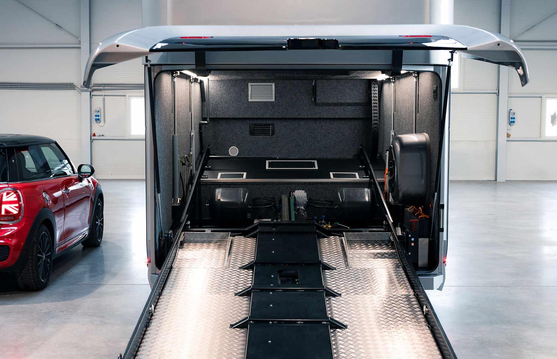 Dembell Motorhome M: high-tech garage with hydraulic lifts