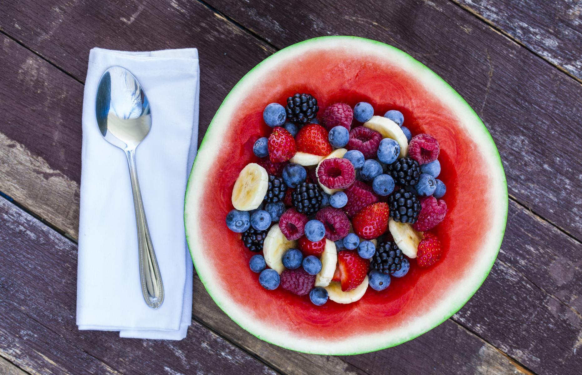 Greek yogurt and berries in a watermelon bowl (156 calories)