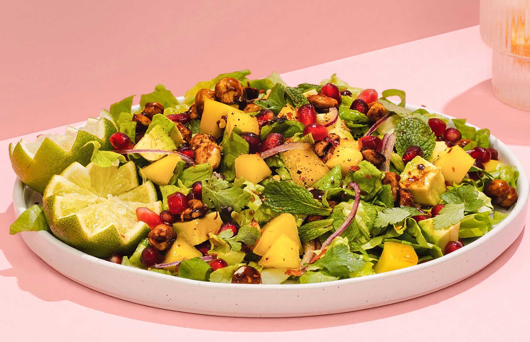 Mango salad with peanuts and pomegranate
