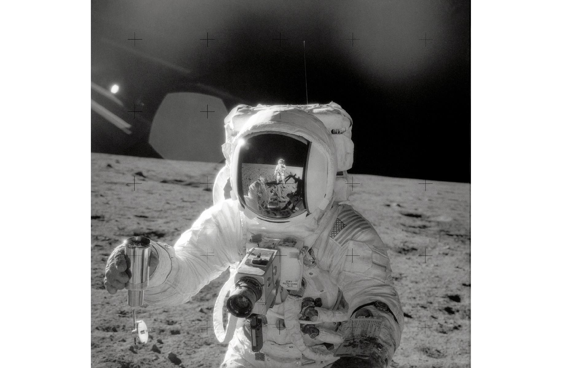 Astronaut samples lunar soil from the moon