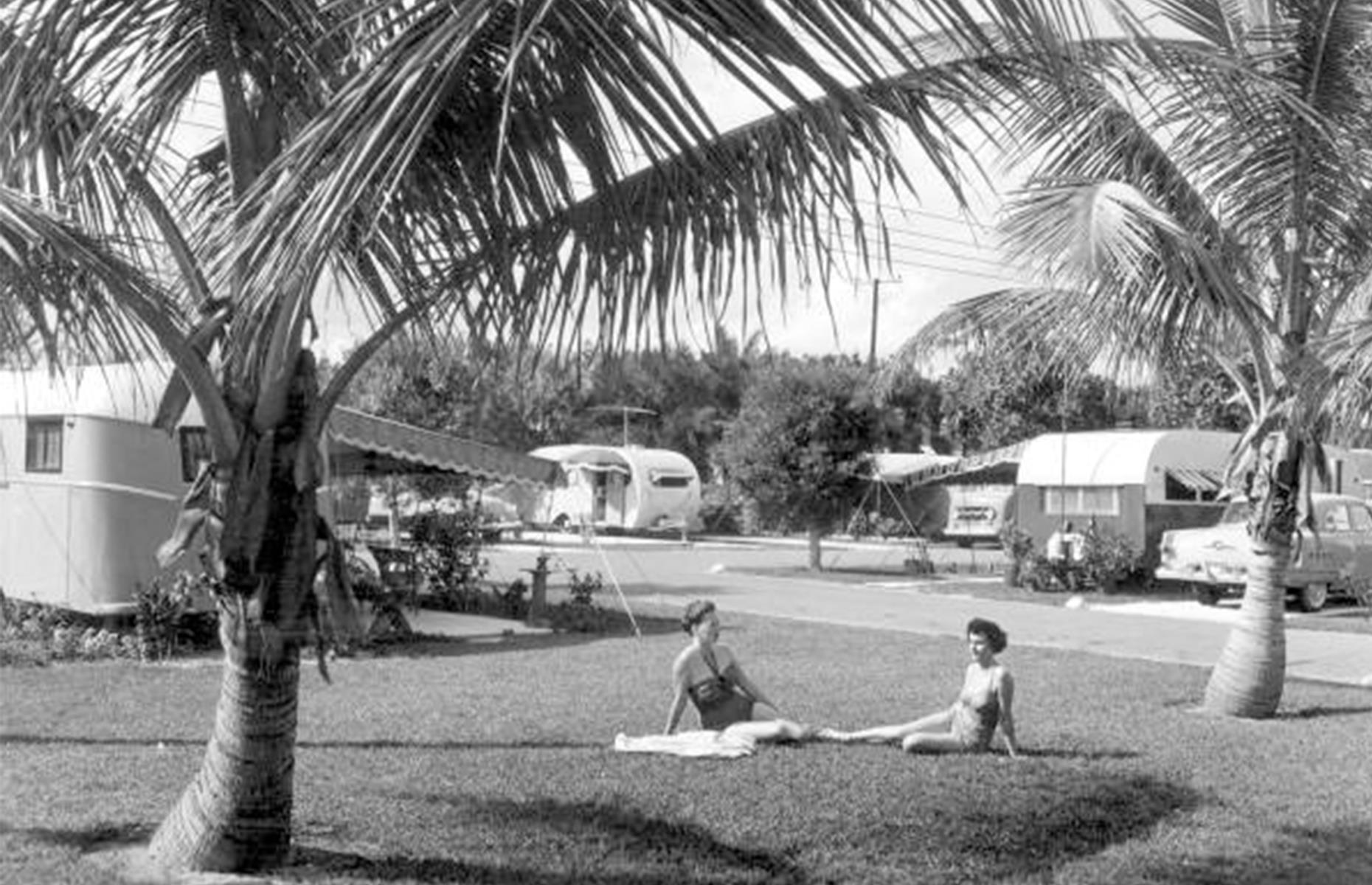 Two women sunbathe at a Hollywood Beach trailer park