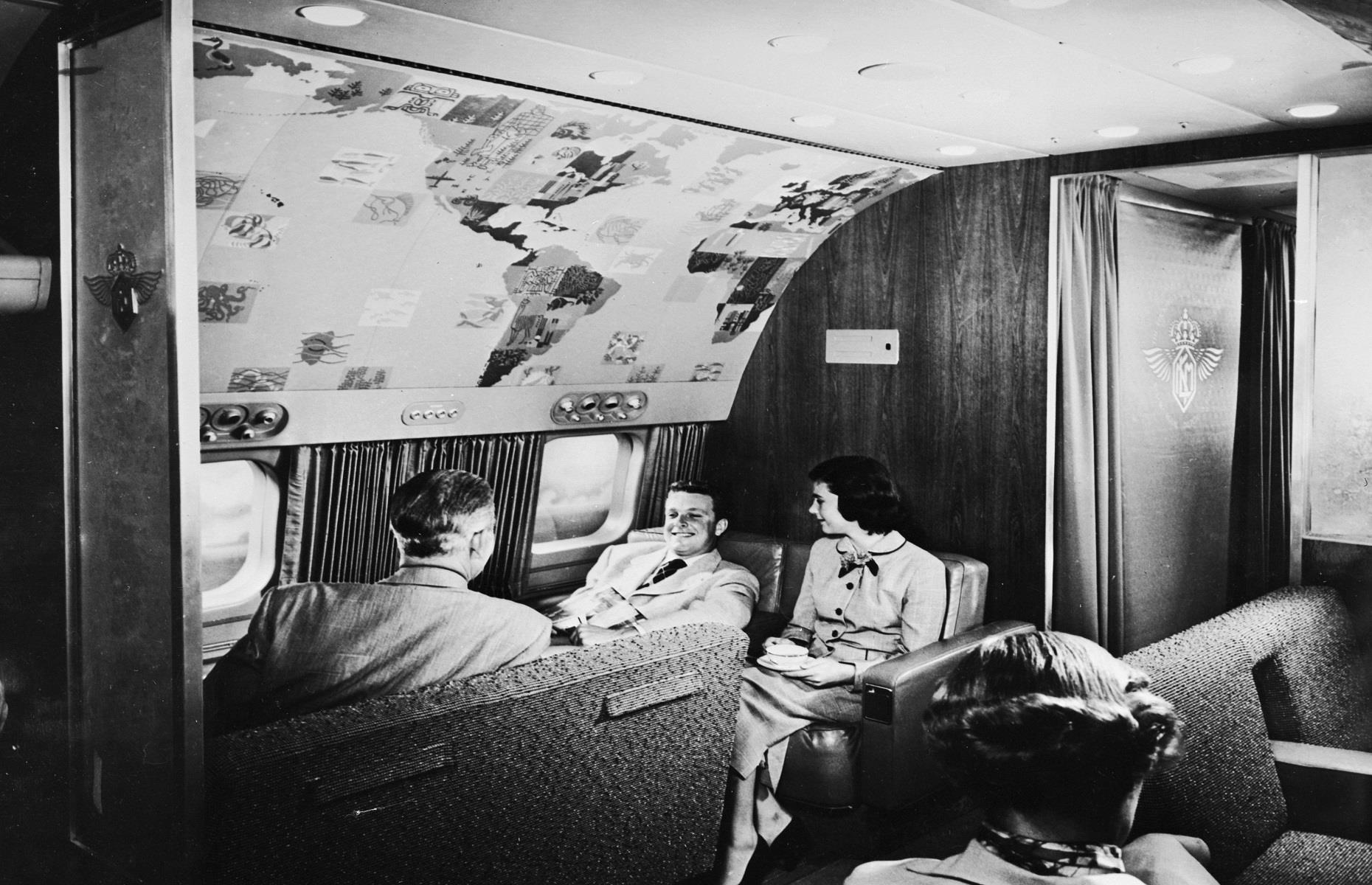 1950s: guests relax in an onboard lounge compartment