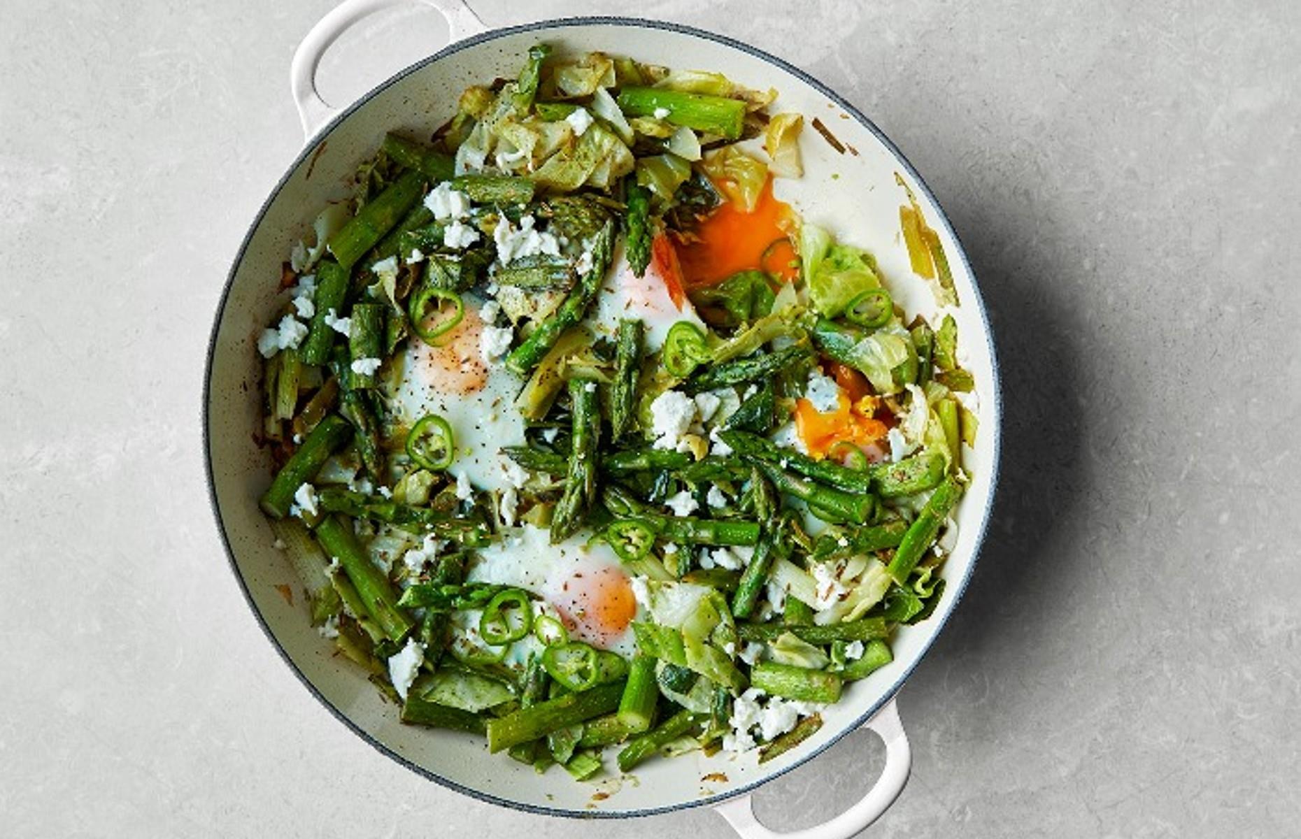Green baked eggs with asparagus