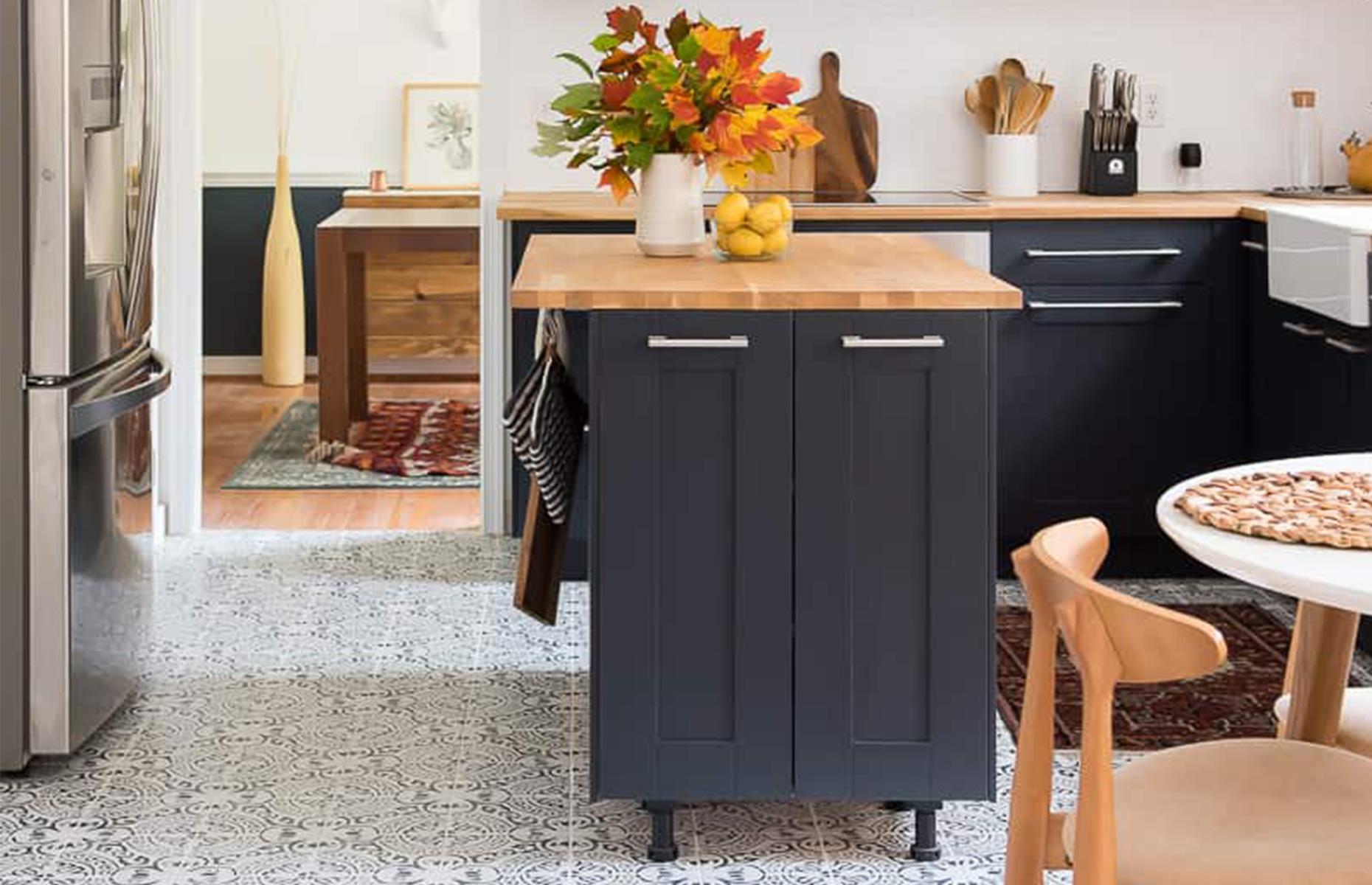 Stylish navy kitchen with statement floor
