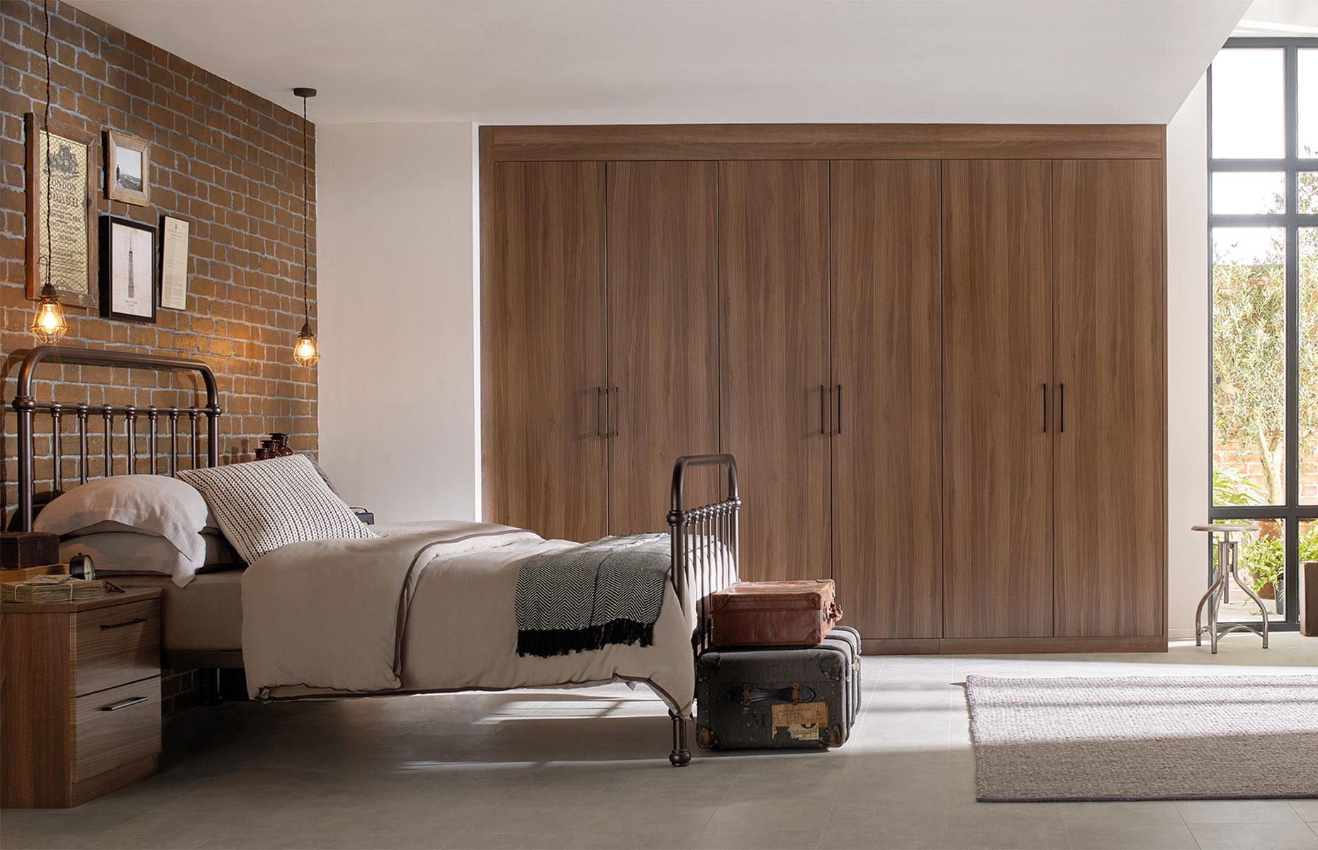 Go for dark wood in the bedroom