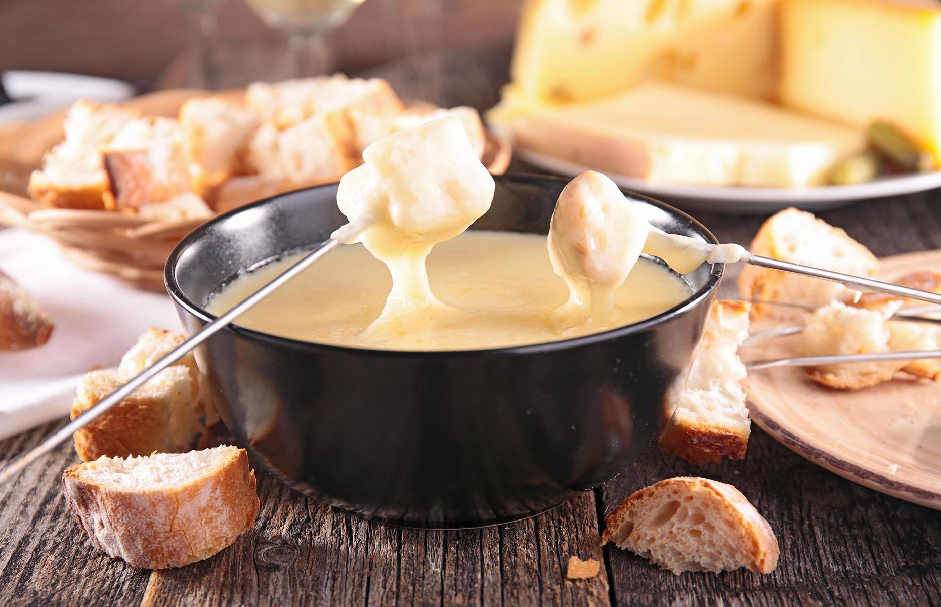 22. Cosy up with fondue in the Swiss Alps