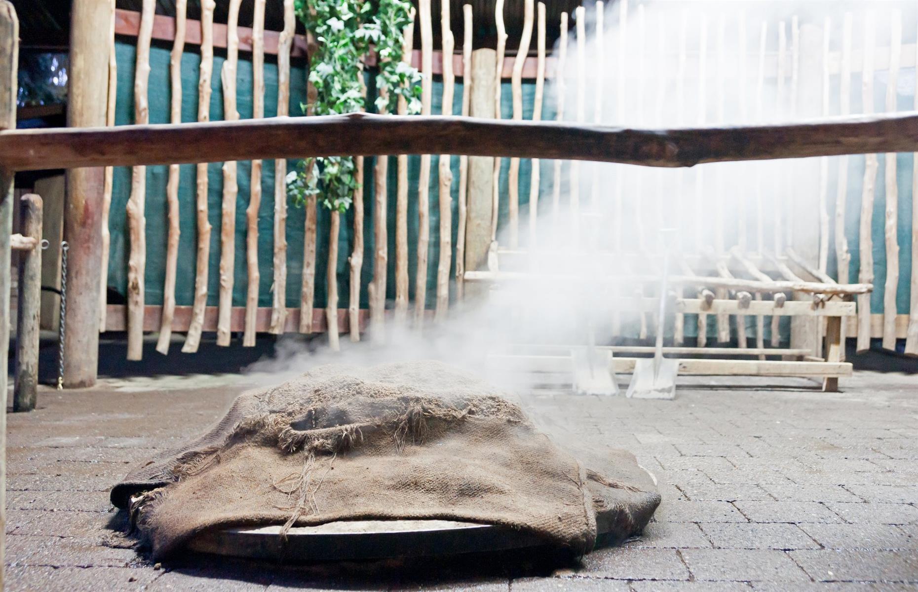 25. Taste hangi-cooked lamb in New Zealand