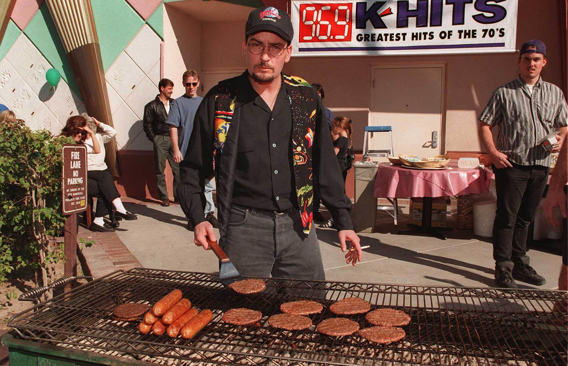 1990: Charlie Sheen flips burgers at Planet Hollywood 