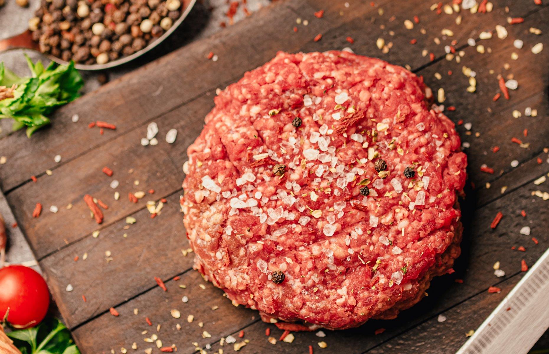 Season meat from above