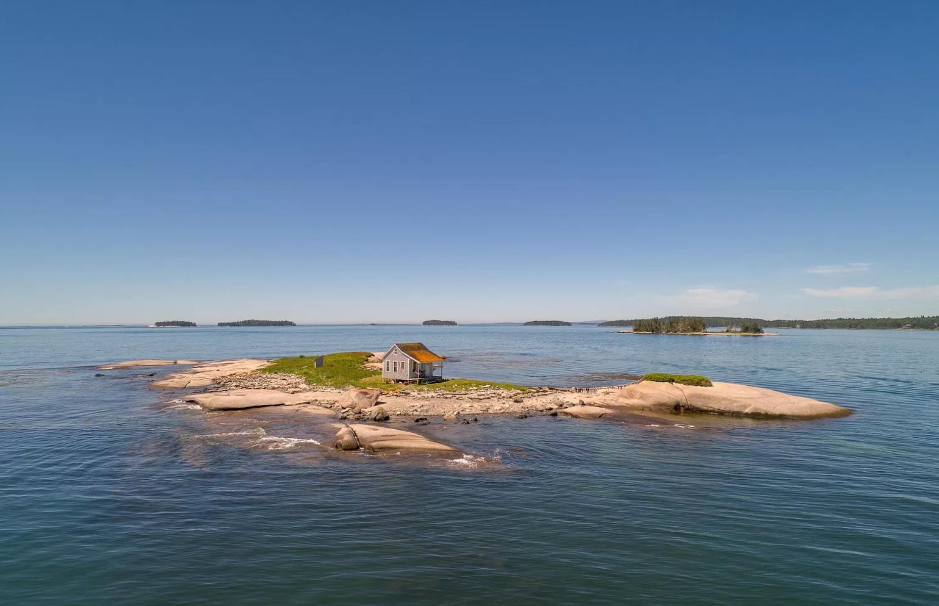 The ultimate getaway cabin is for sale, complete with its own island!