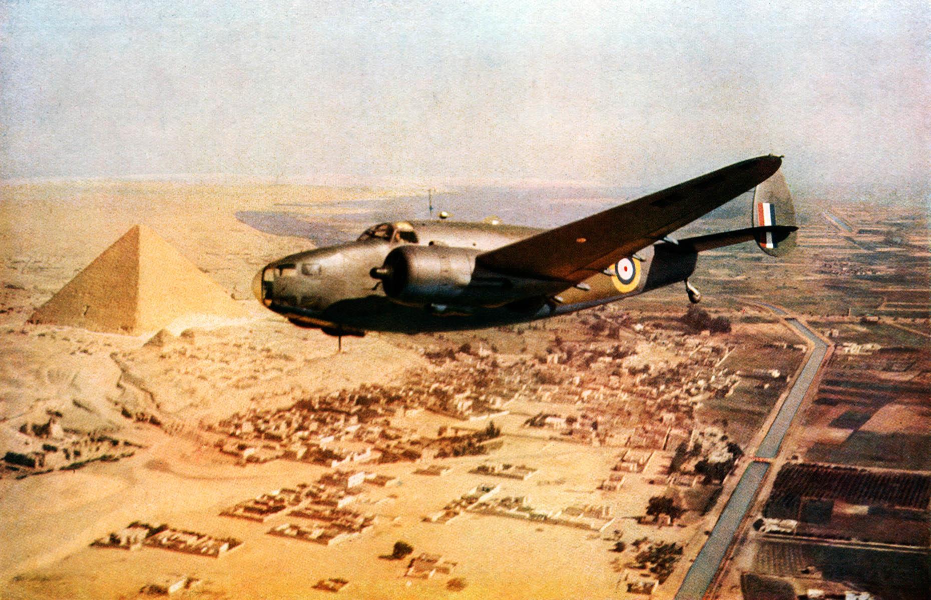 1942: an RAF bomber flies over the pyramids, Egypt