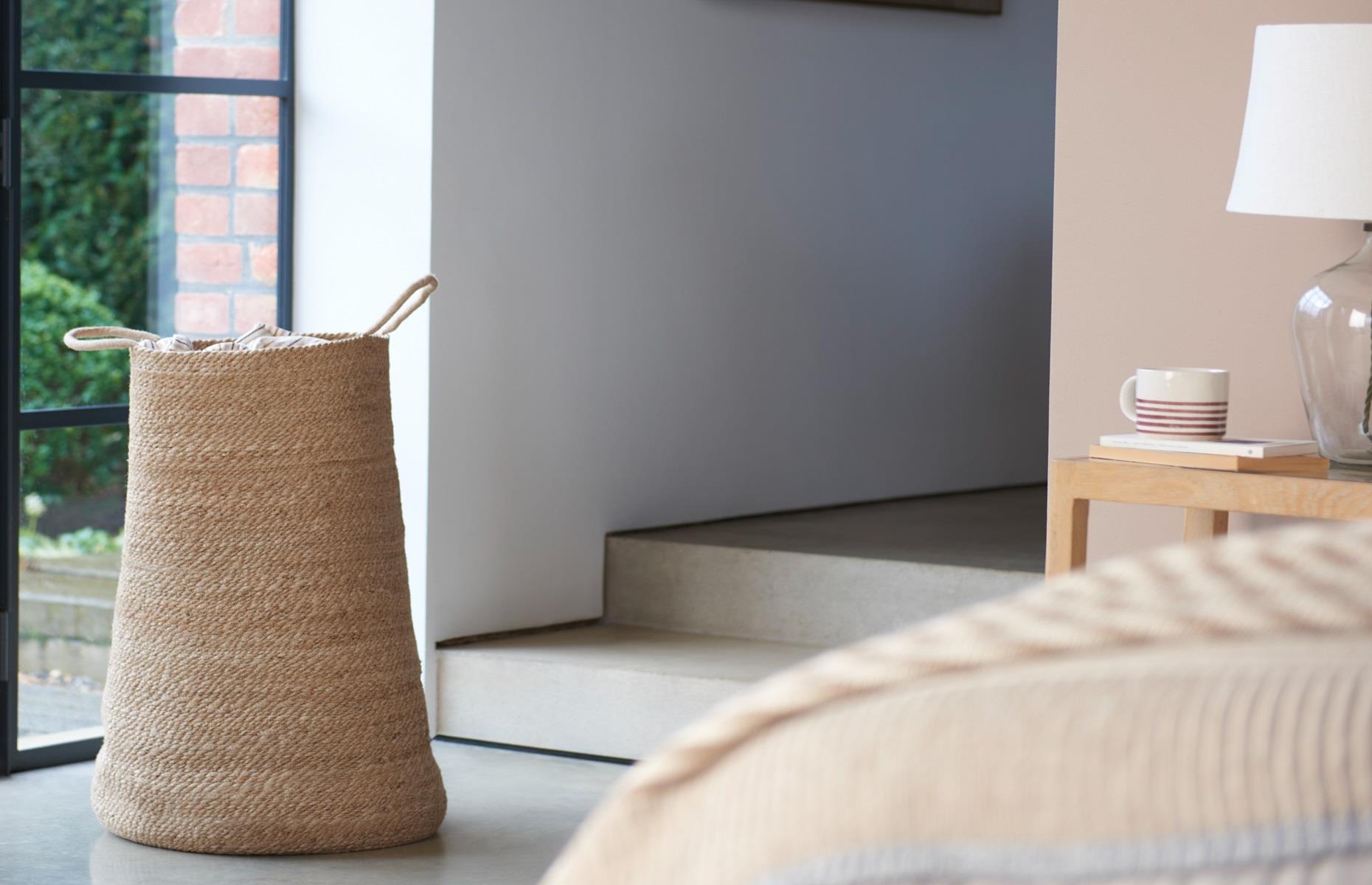 Pop a laundry bin in the bedroom