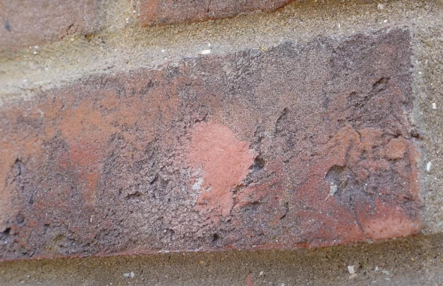 Fill holes in walls with brick dust