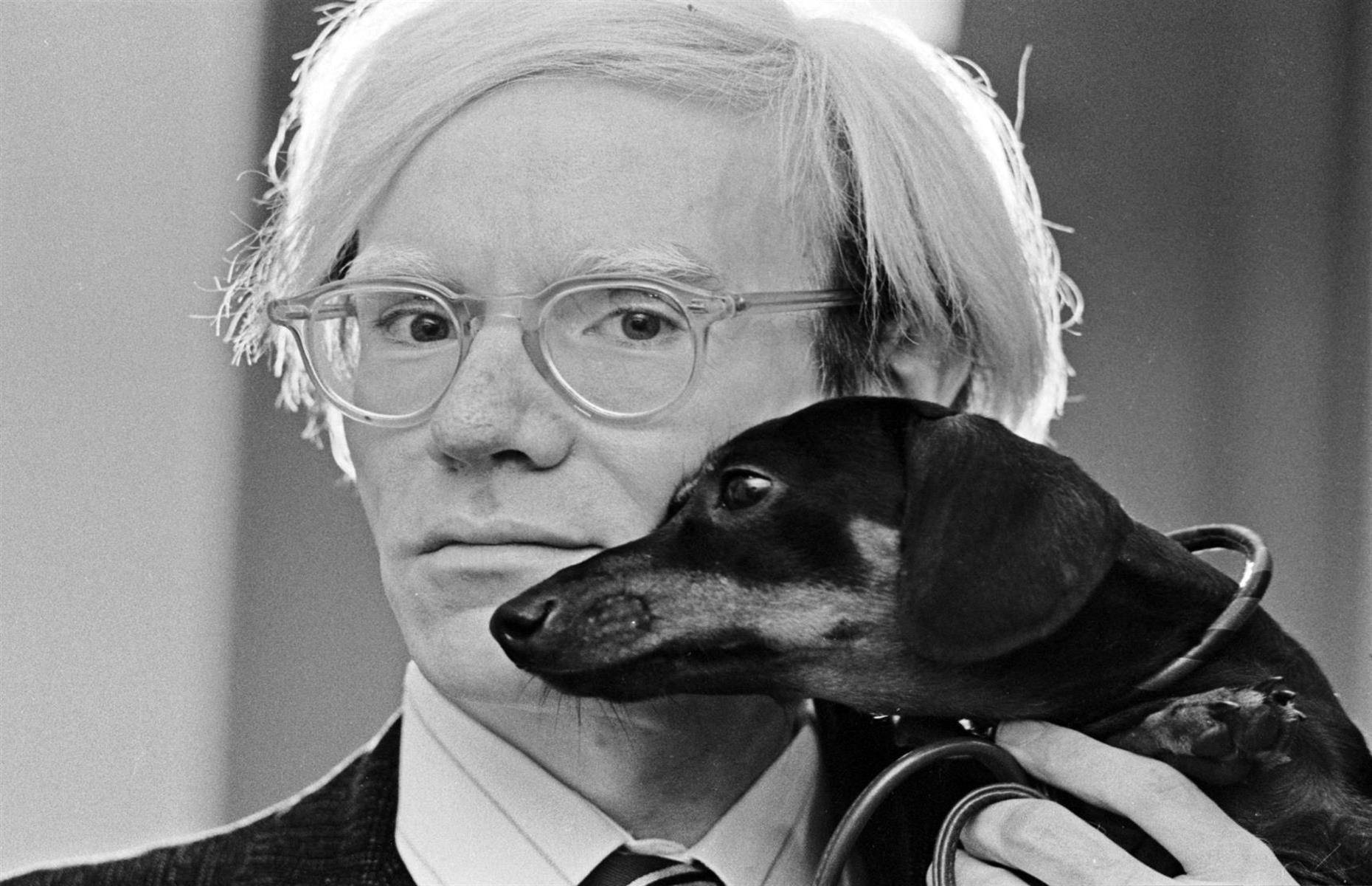 1973: Andy Warhol and his beloved dachshund Archie 