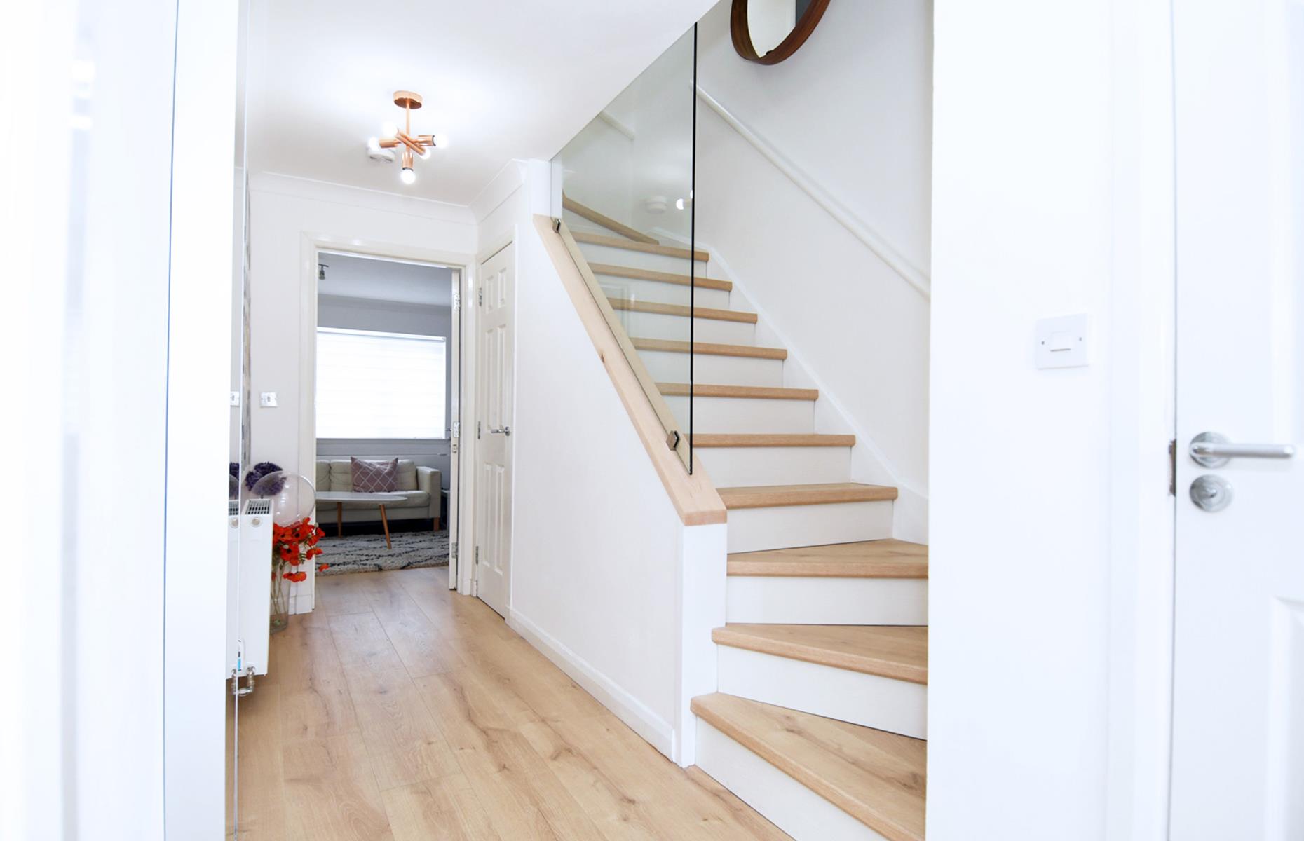 After: a light glass hallway