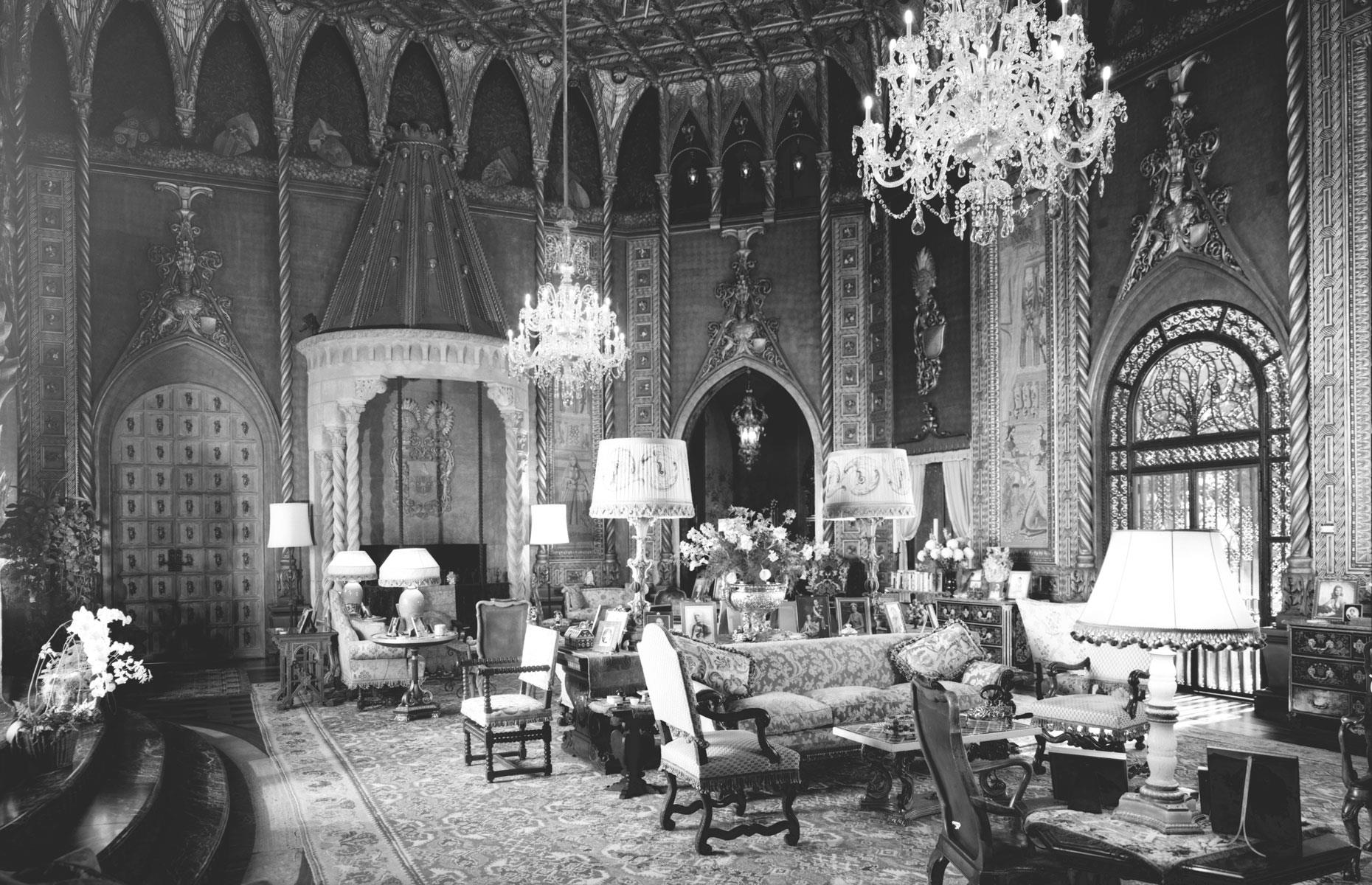 The living room boasts a gold-plated ceiling and walls