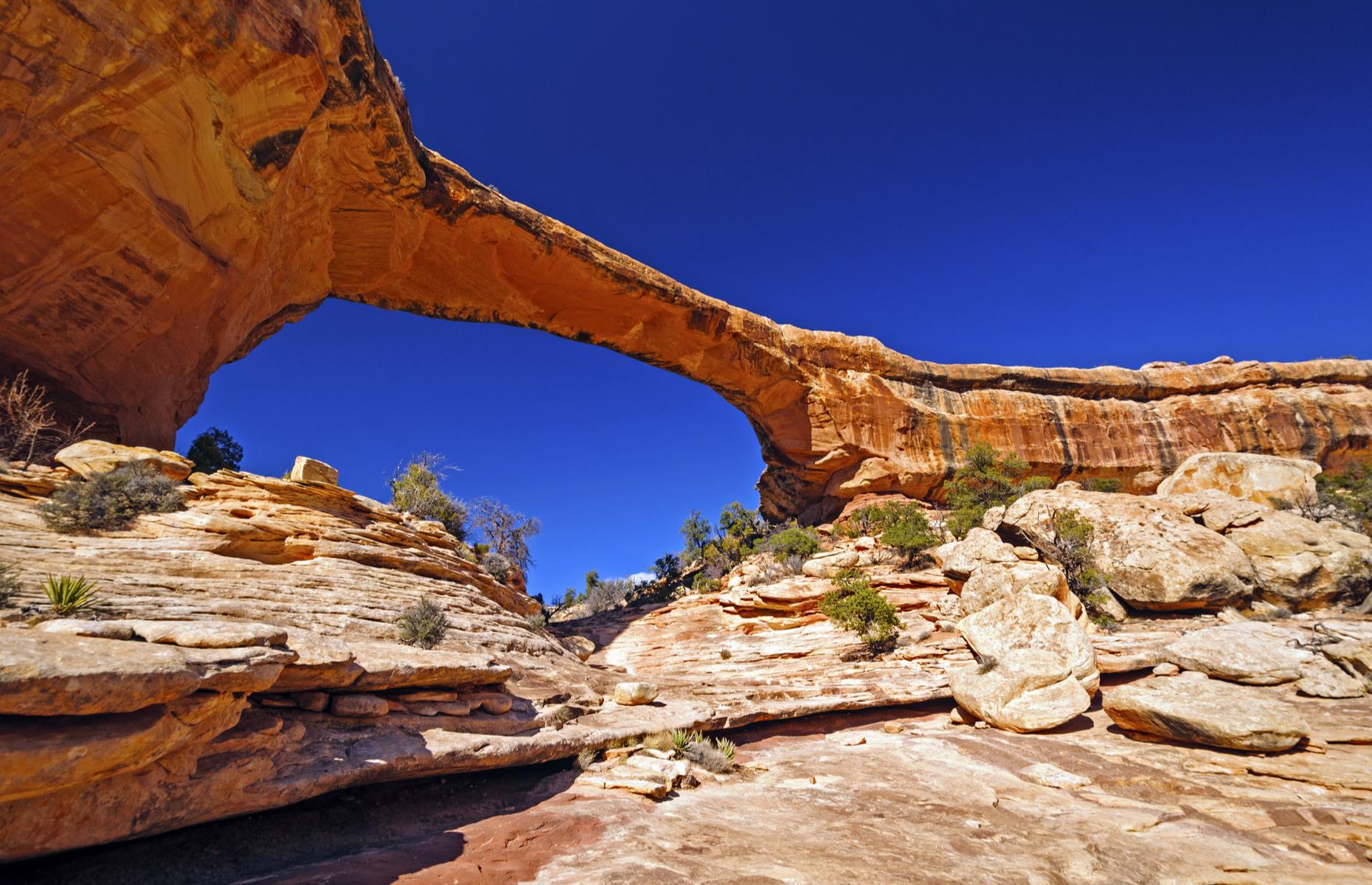 Visit Natural Bridges National Monument over Arches National Park in Utah