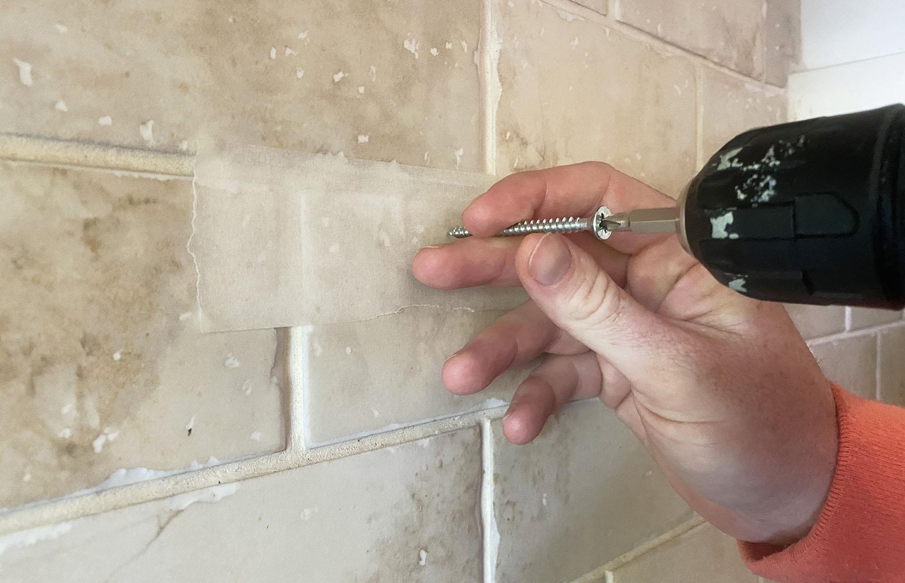 Use tape to keep a drill steady