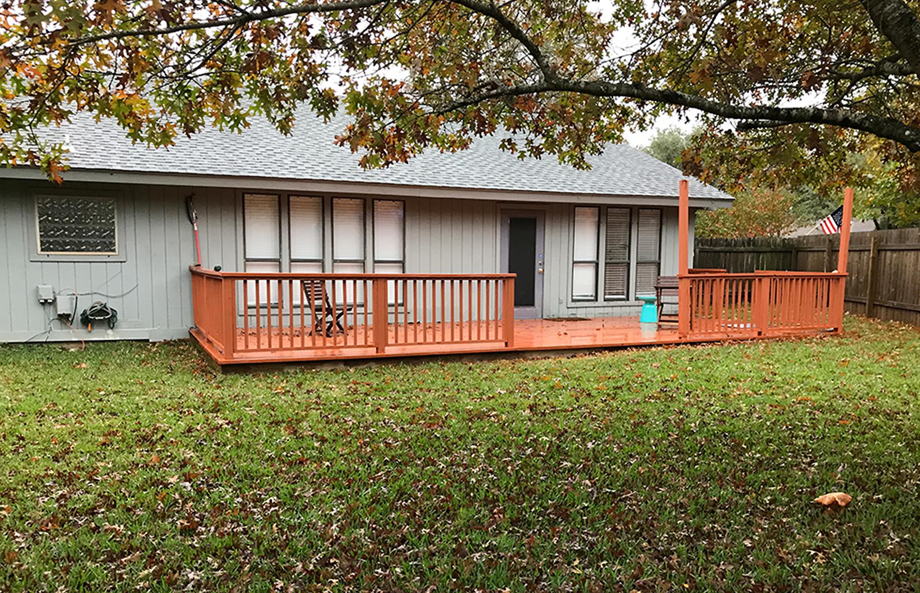Before: a sparse backyard deck
