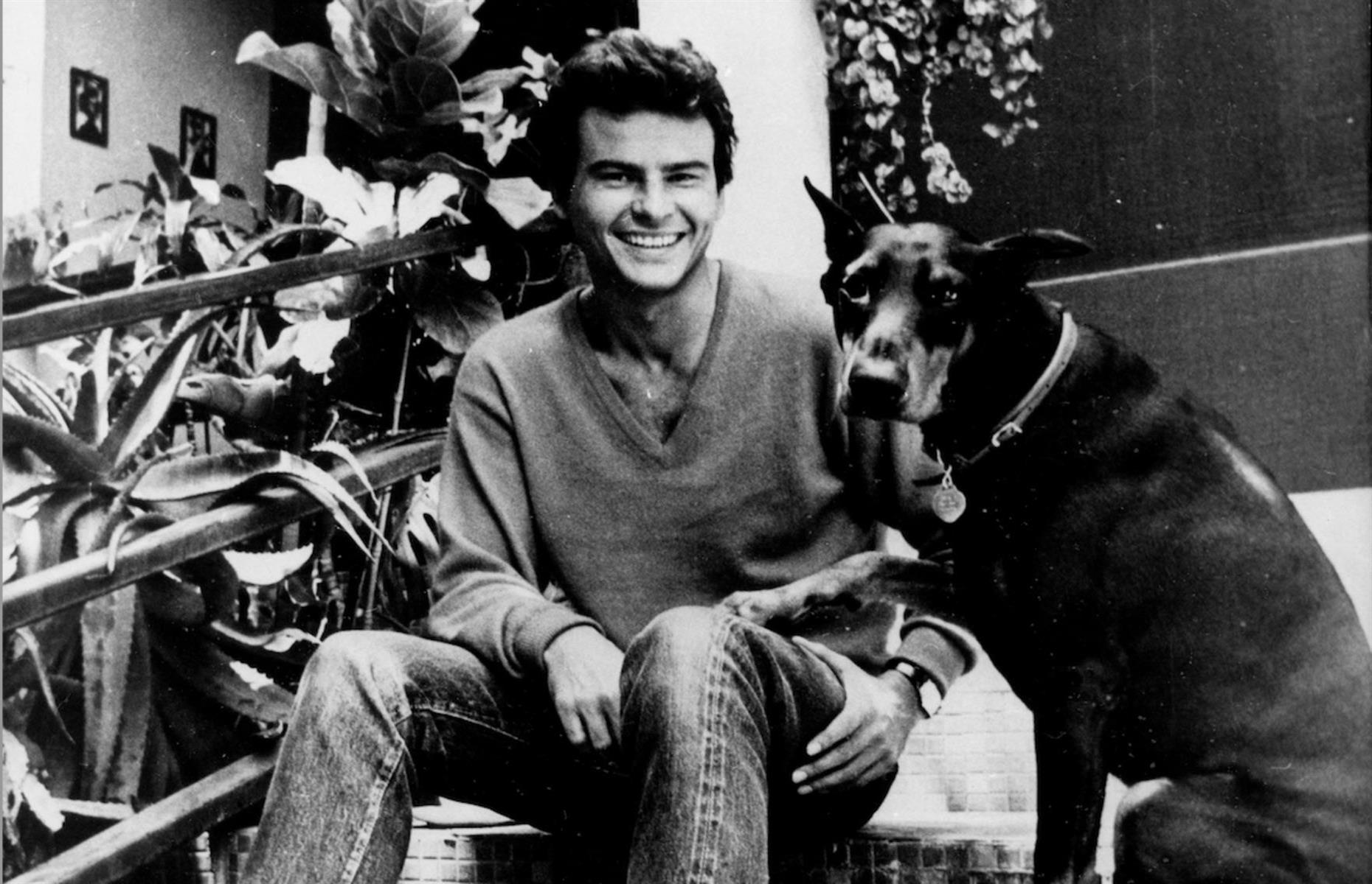 1970: Horst Buchholz sits on his patio beside his dog