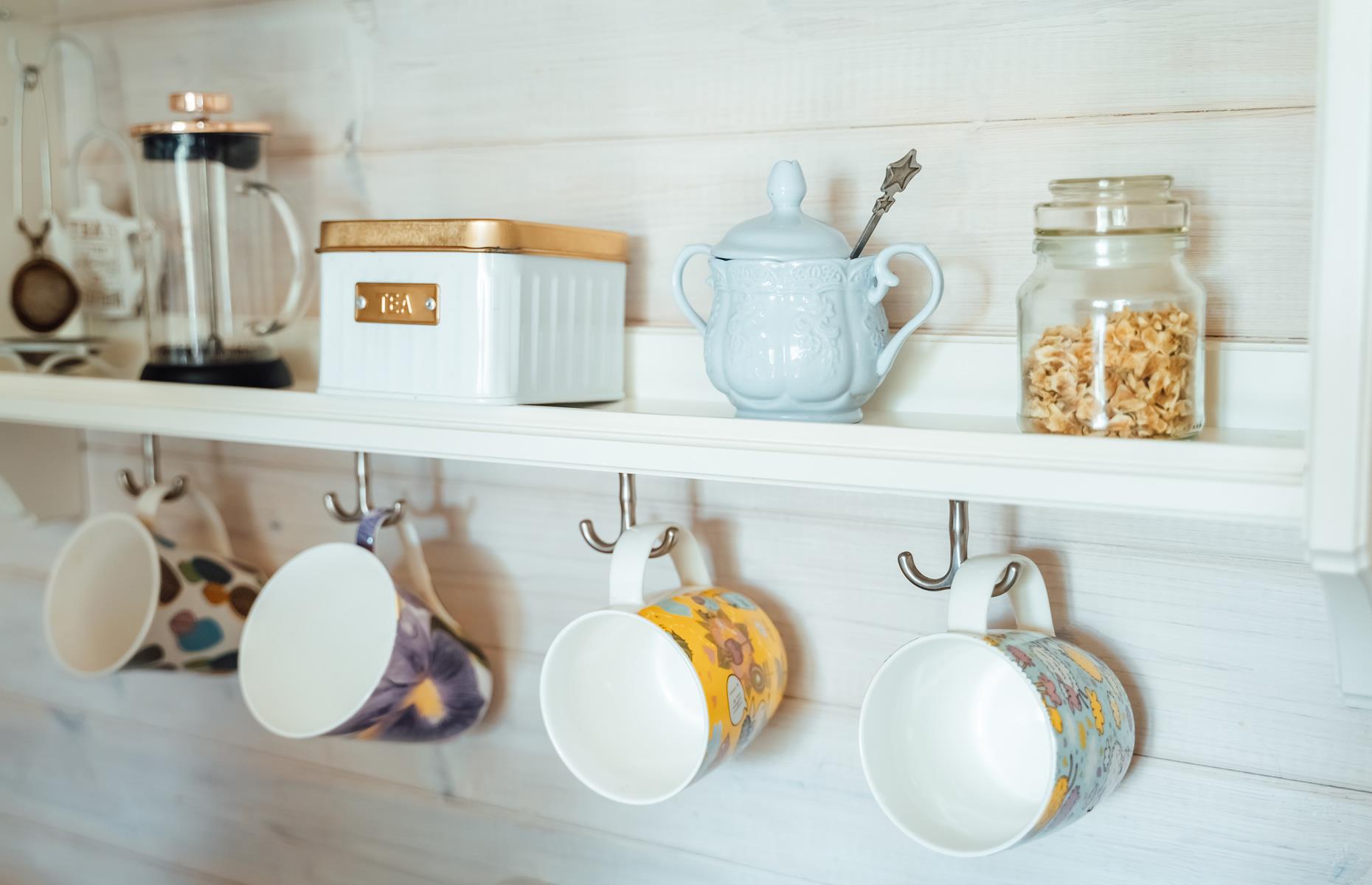 Add hooks beneath shelves
