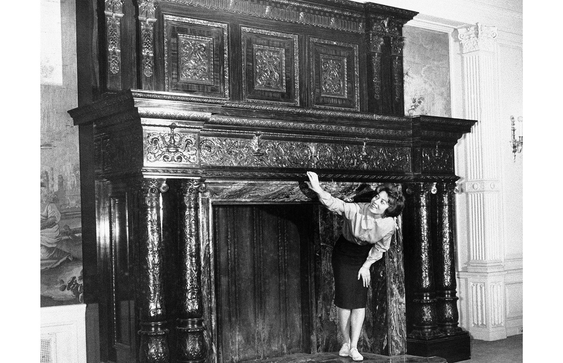 1961: a young woman explores the fireplace at Henry Ford's Fair Lane