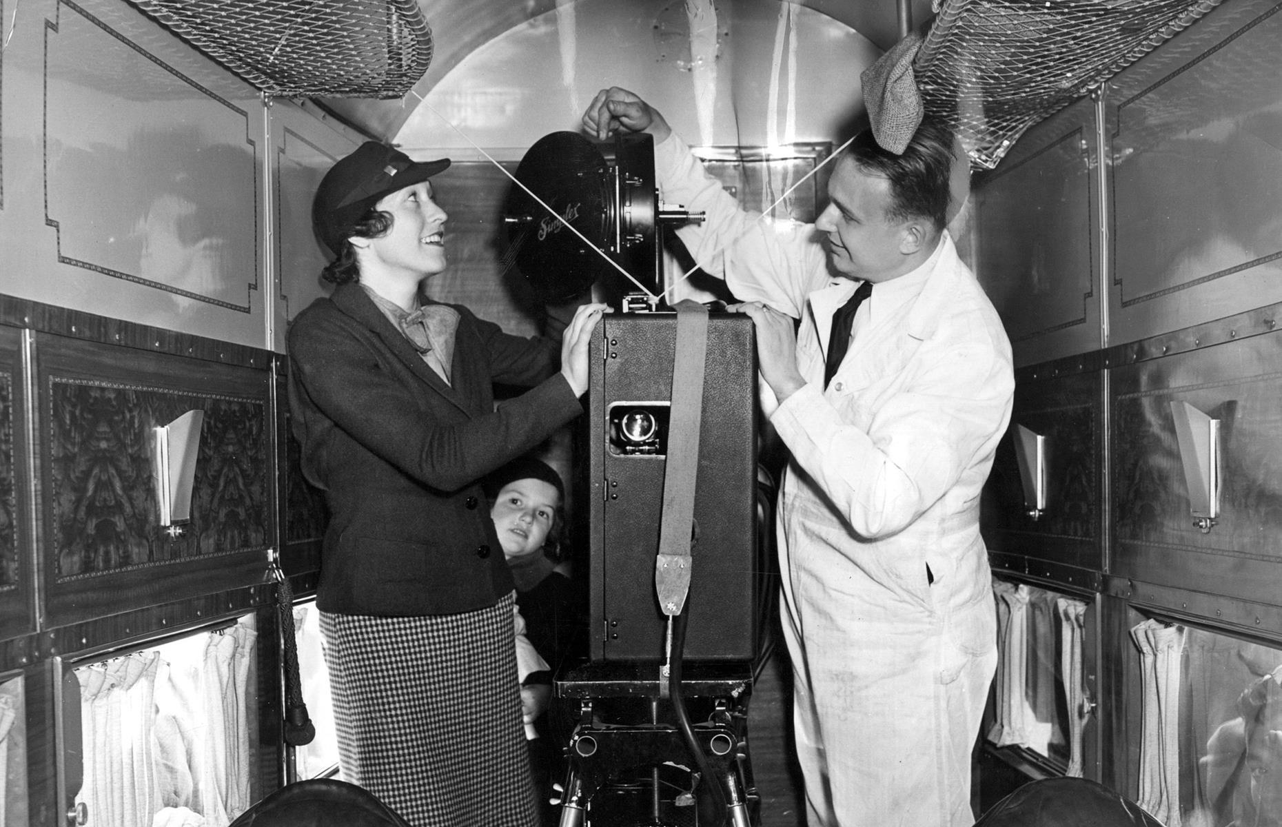 1950s: a movie projector on a United Airlines flight