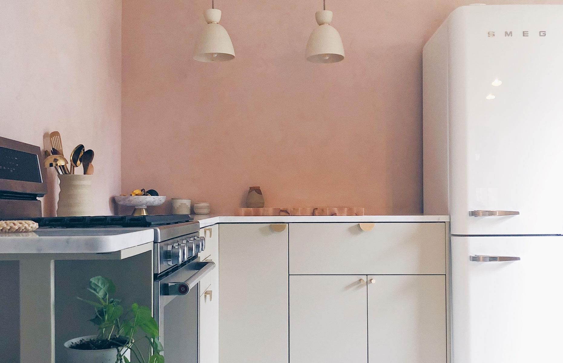 Luxurious pared-back pink kitchen