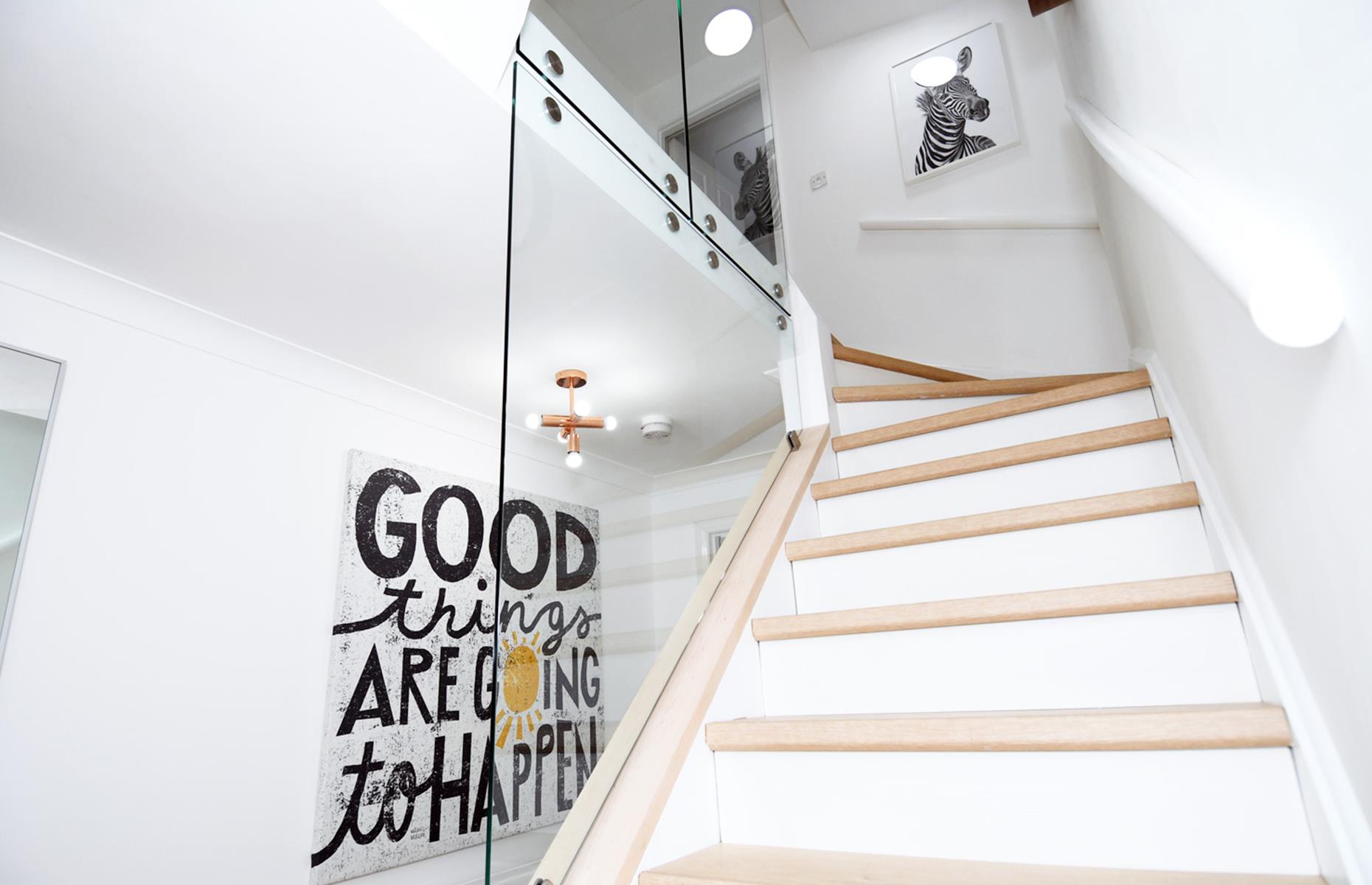 After: a light glass hallway