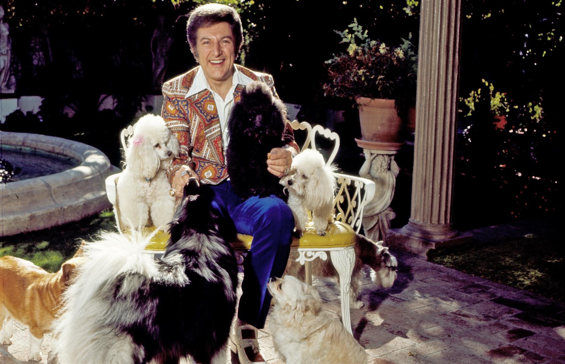 1980: Liberace with his dogs at his home in Palm Springs