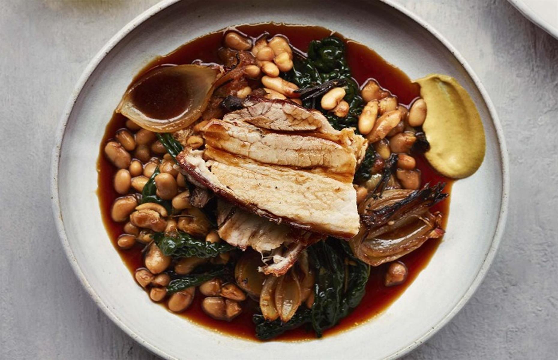 Slow-roasted pork belly with cannellini beans
