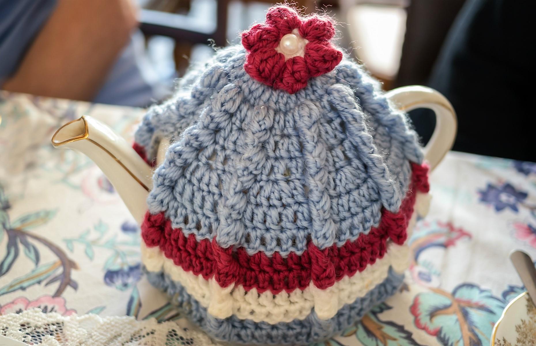 A teapot with a cosy