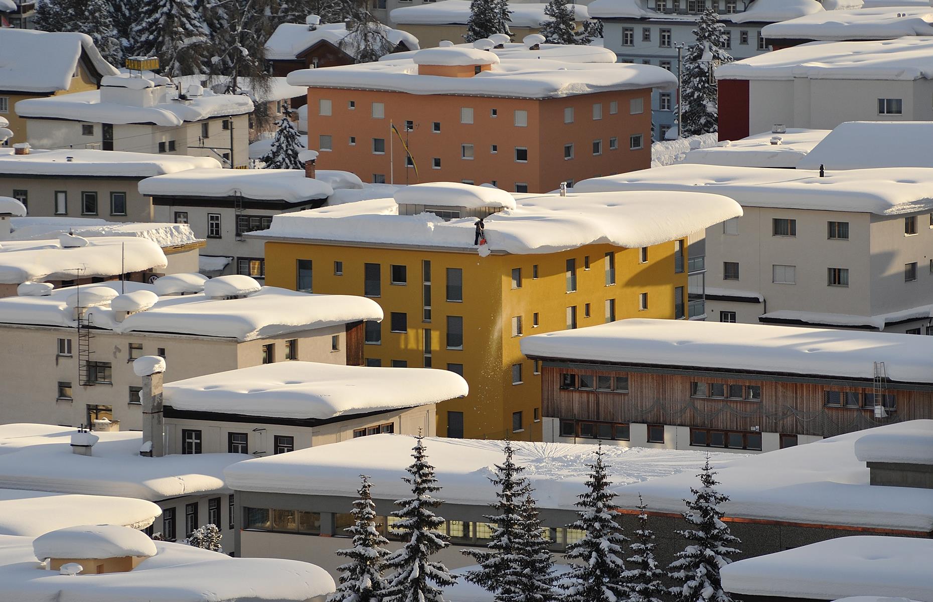 Houses straining under snowfall, Graubünden, Switzerland