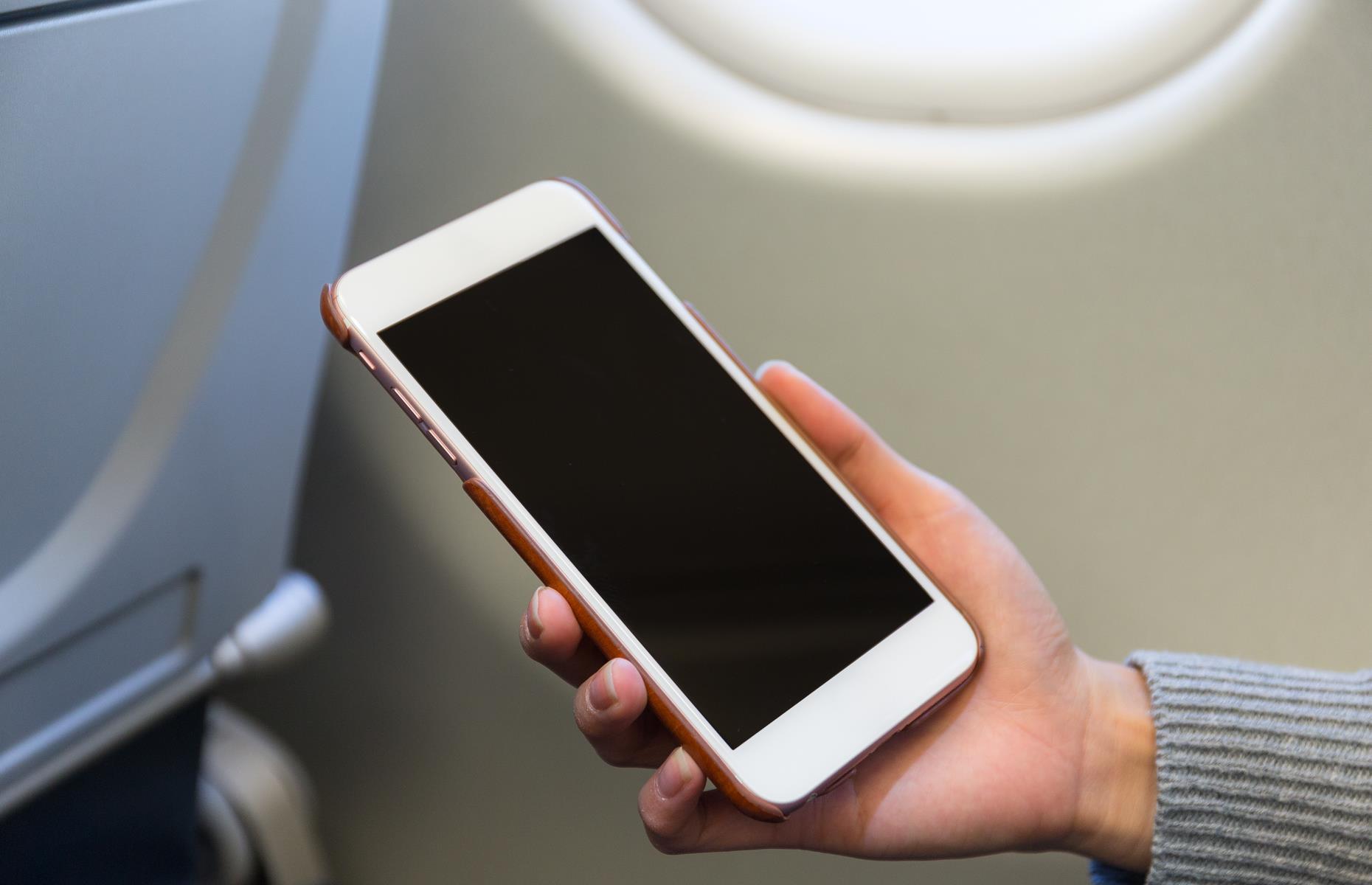 If your phone's left on, it probably won't interfere with the equipment