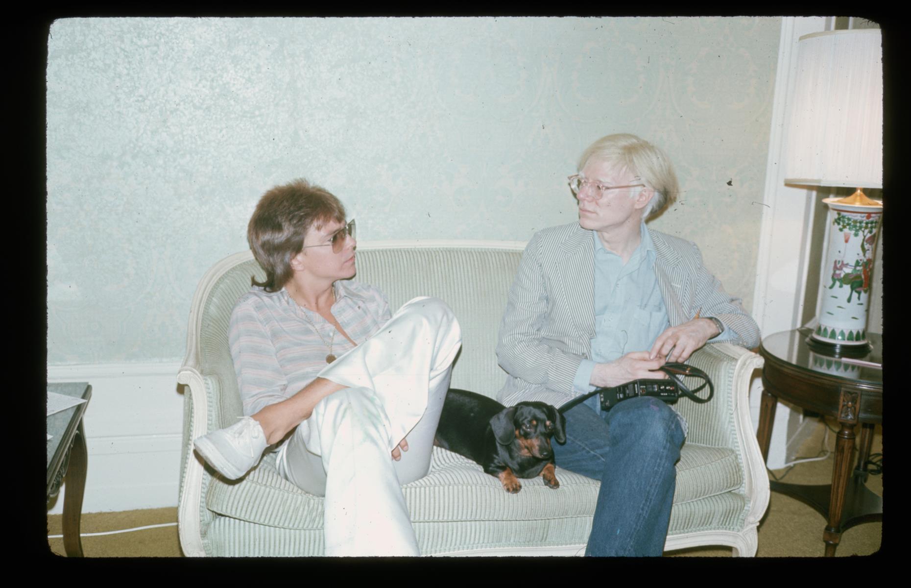 1975: Andy Warhol chats to singer David Cassidy with dog Archie 
