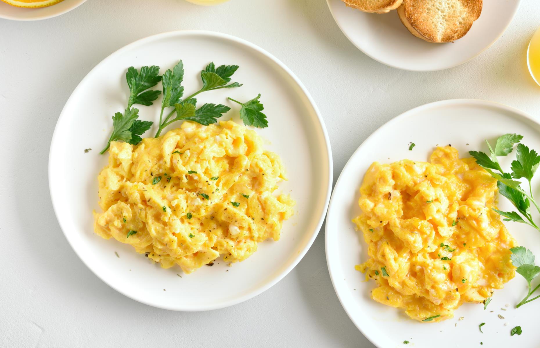 Fold scrambled eggs in a figure of eight