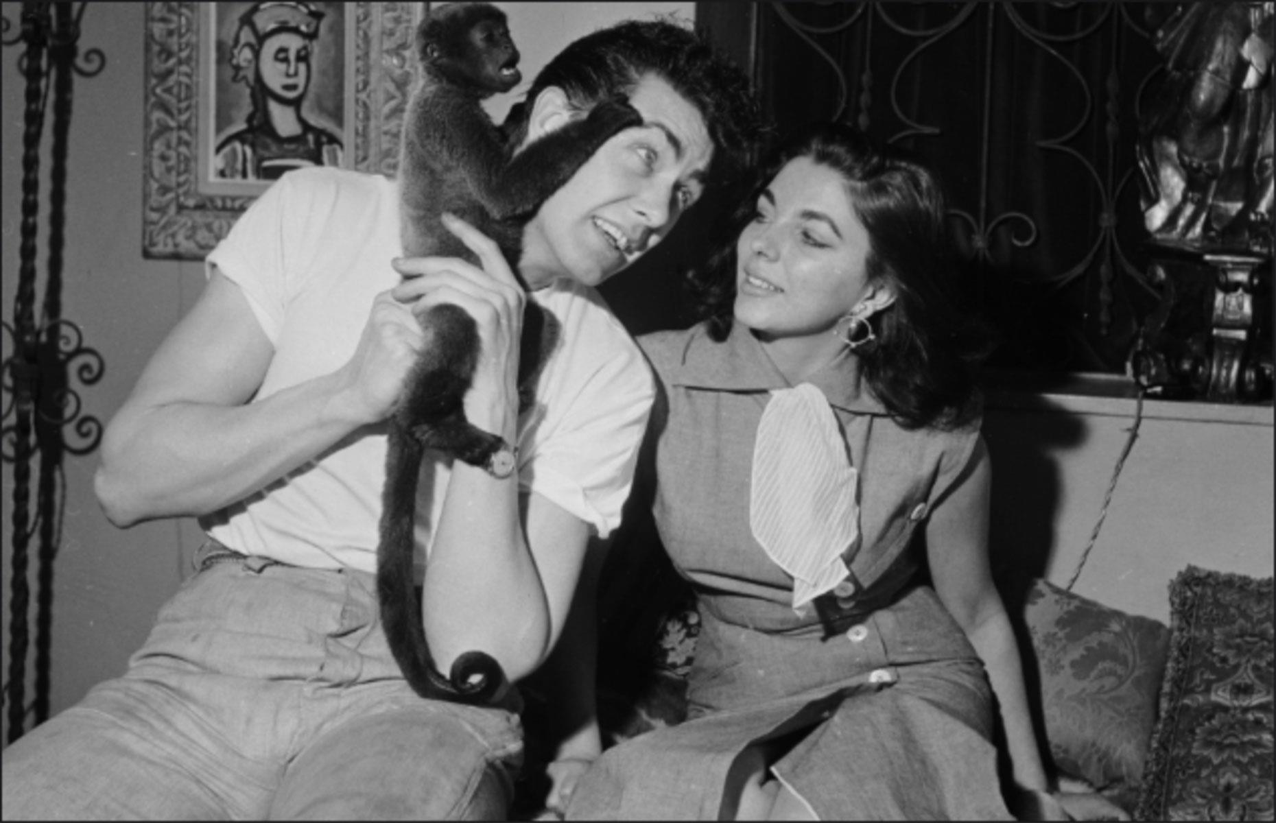 1953: Dame Joan Collins and Maxwell Reed with their pet monkey Spider 